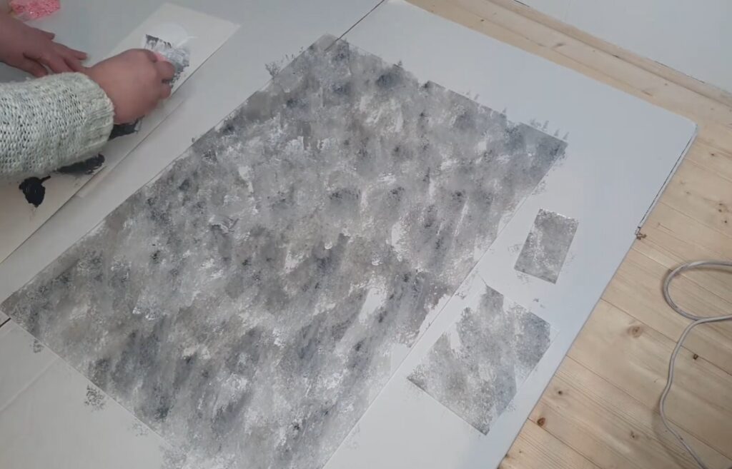image of me painting the acrylic unplugged welcome sign